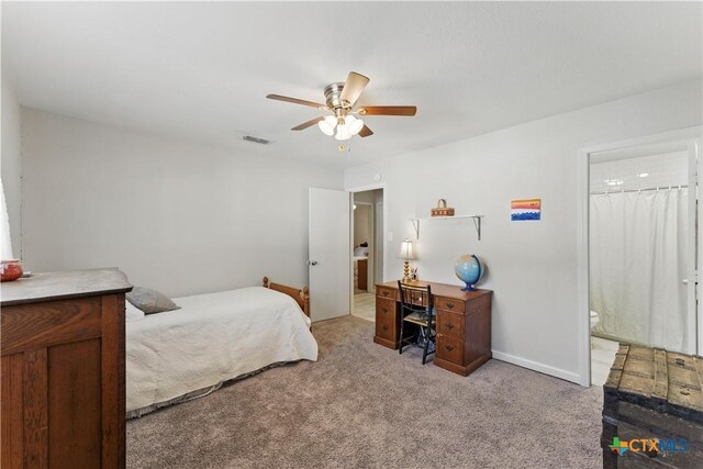 226 Gruene Rd, New Braunfels, TX 78130 - carpeted bedroom featuring ceiling fan, ensuite bath, visible vents, and baseboards