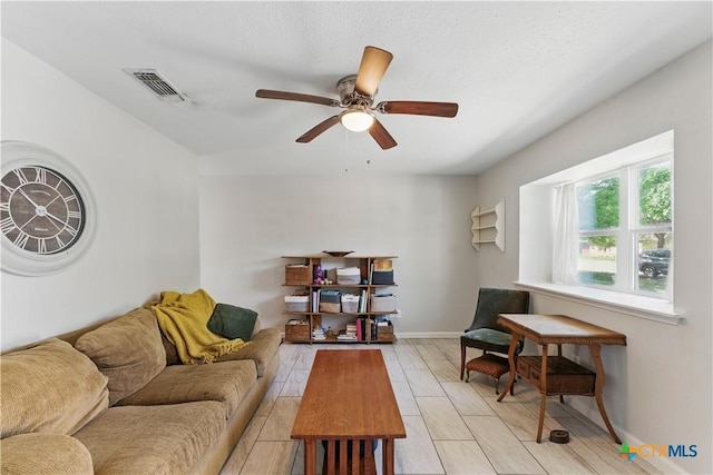 226 Gruene Rd, New Braunfels, TX 78130 - living area with visible vents, baseboards, and ceiling fan