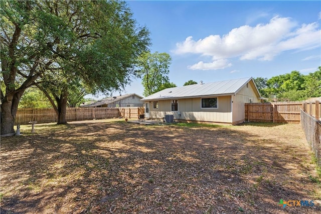 226 Gruene Rd, New Braunfels, TX 78130 - rear view of property featuring a fenced backyard and metal roof