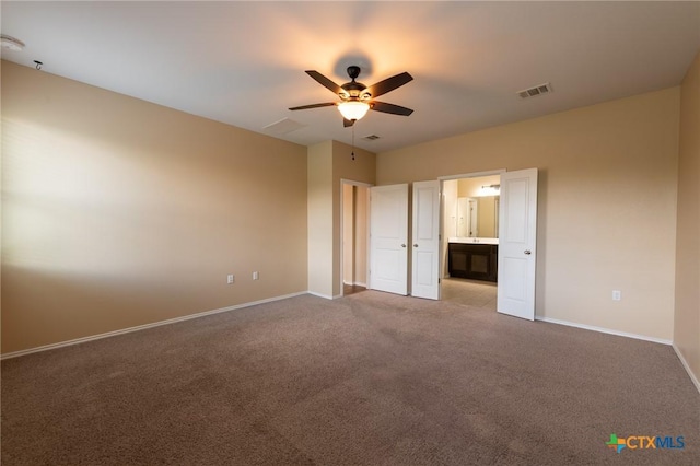 9505 Alex Ln, Austin, TX 78748 - unfurnished bedroom featuring carpet floors, connected bathroom, and ceiling fan