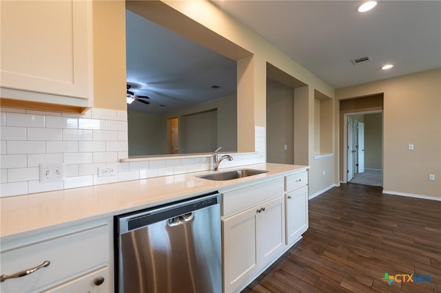 9505 Alex Ln, Austin, TX 78748 - kitchen featuring stainless steel dishwasher, white cabinetry, light countertops, dark wood-style flooring, and recessed lighting
