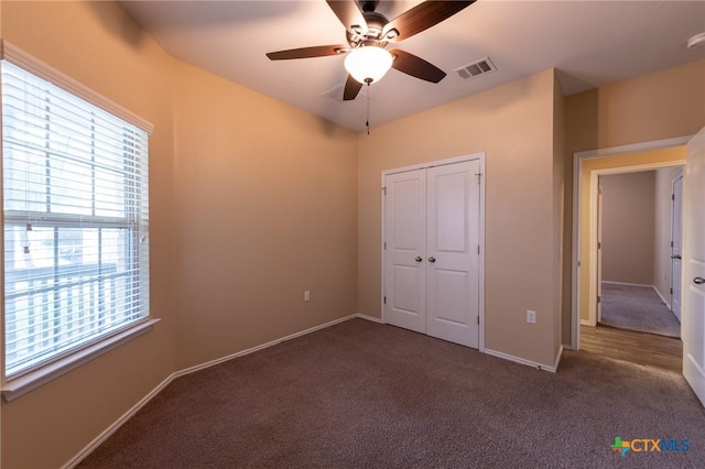 9505 Alex Ln, Austin, TX 78748 - unfurnished bedroom with carpet floors, a closet, and ceiling fan