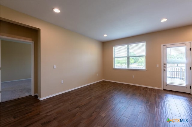 9505 Alex Ln, Austin, TX 78748 - spare room featuring dark wood-type flooring and recessed lighting