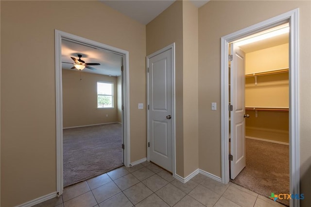 9505 Alex Ln, Austin, TX 78748 - hall with light colored carpet and light tile patterned flooring