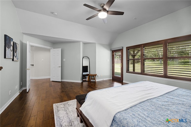 bedroom with ceiling fan, dark hardwood / wood-style floors, and lofted ceiling