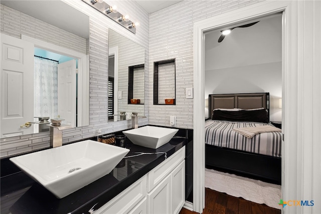 bathroom featuring vanity and hardwood / wood-style floors