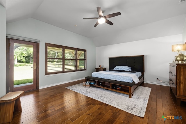 bedroom featuring dark hardwood / wood-style flooring, ceiling fan, access to exterior, and vaulted ceiling