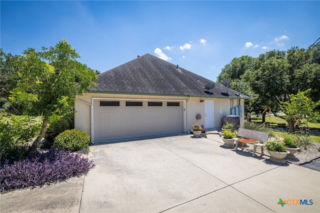 ranch-style home featuring a garage