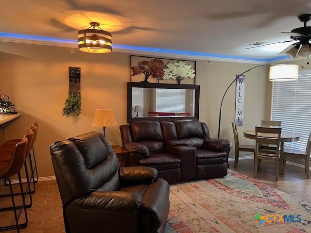 730 E Mather St Unit K203, New Braunfels, TX 78130 - tiled living room featuring ceiling fan and crown molding