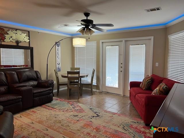 730 E Mather St Unit K203, New Braunfels, TX 78130 - living area with a ceiling fan, ornamental molding, and tile patterned floors