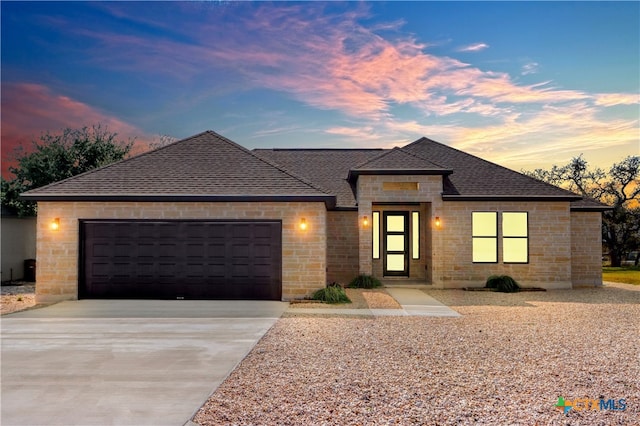 prairie-style house featuring a garage