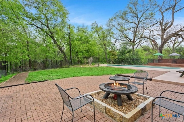 102 Elm Dr, Belton, TX 76513 - view of patio / terrace featuring a fenced in pool, a fire pit, and a fenced backyard