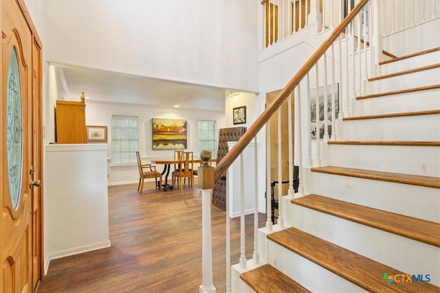 102 Elm Dr, Belton, TX 76513 - entrance foyer featuring baseboards, a high ceiling, stairs, and wood finished floors