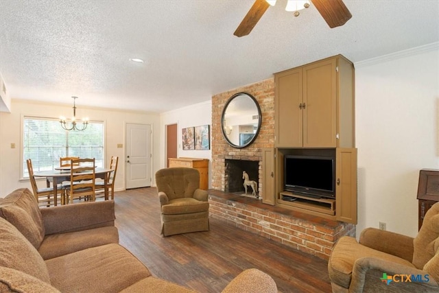102 Elm Dr, Belton, TX 76513 - living area with ornamental molding, wood finished floors, a fireplace, a textured ceiling, and ceiling fan with notable chandelier