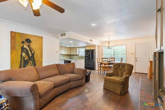 102 Elm Dr, Belton, TX 76513 - living area featuring visible vents, wood-type flooring, recessed lighting, a textured ceiling, and ceiling fan with notable chandelier