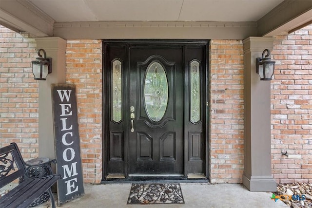 102 Elm Dr, Belton, TX 76513 - doorway to property featuring brick siding