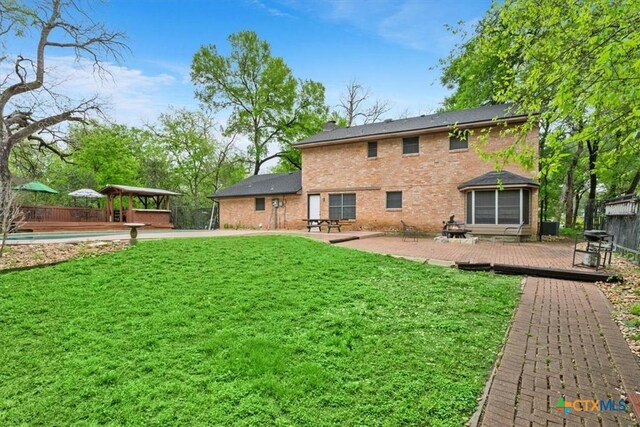 102 Elm Dr, Belton, TX 76513 - back of house featuring a lawn, a deck, a gazebo, and fence