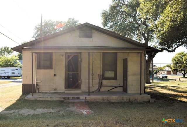 back of property featuring a porch