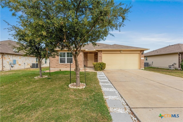 ranch-style home featuring a front yard, a garage, and central AC unit