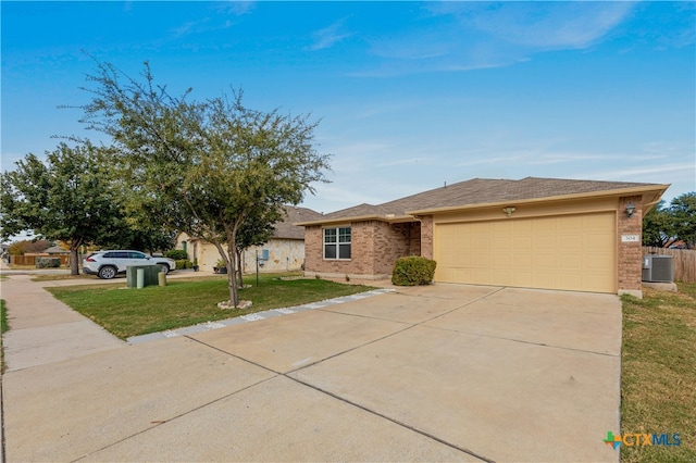 ranch-style home with central air condition unit, a front lawn, and a garage