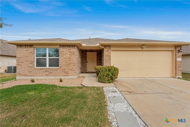 ranch-style house featuring a garage, central air condition unit, and a front lawn