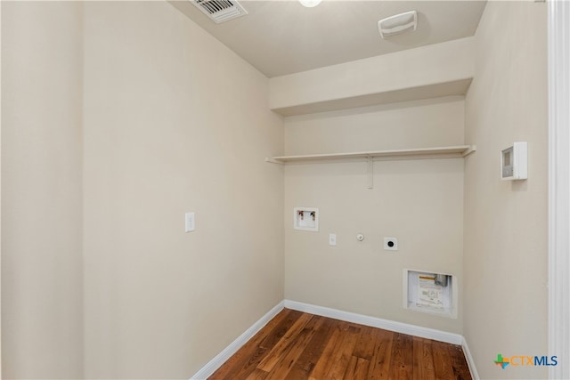 washroom featuring washer hookup, dark hardwood / wood-style floors, electric dryer hookup, and gas dryer hookup