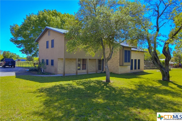 view of front of home with a front yard