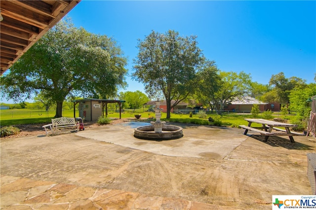 view of patio / terrace with a storage shed