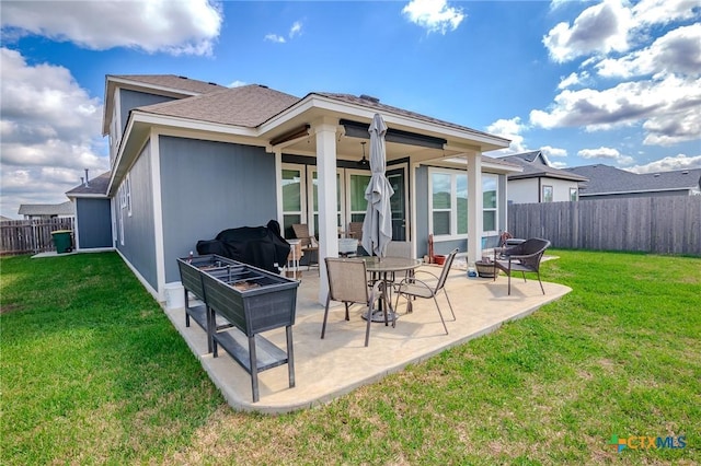 111 Dripping Spg, Victoria, TX 77904 - back of property with a fenced backyard and a patio