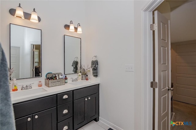 111 Dripping Spg, Victoria, TX 77904 - bathroom featuring double vanity and tile patterned floors