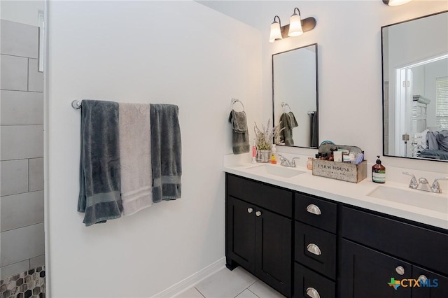 111 Dripping Spg, Victoria, TX 77904 - bathroom with double vanity, tile patterned floors, and connected bathroom