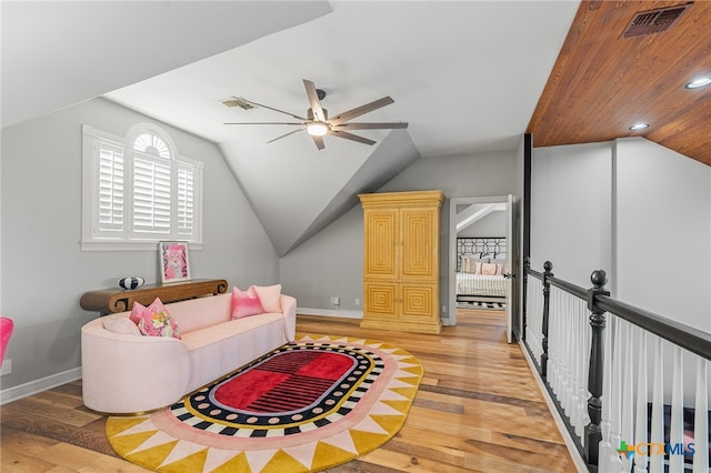 sitting room featuring lofted ceiling, wood-type flooring, and ceiling fan