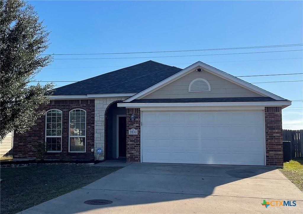 ranch-style house featuring a garage