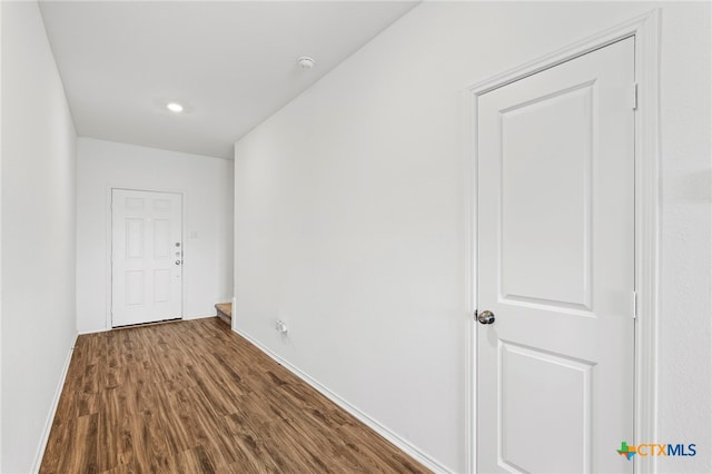 hallway featuring hardwood / wood-style flooring