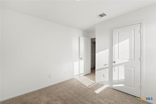 unfurnished bedroom with light carpet