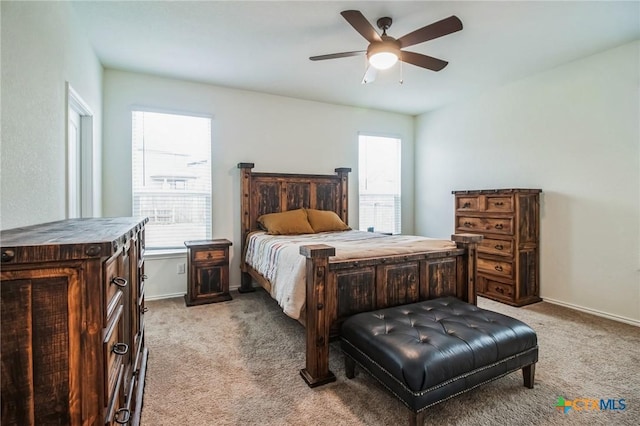 bedroom with light colored carpet and ceiling fan