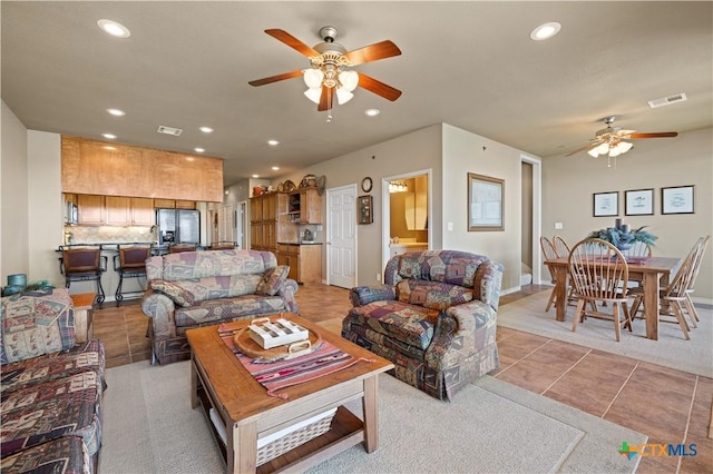 living room with recessed lighting, visible vents, ceiling fan, and light tile patterned flooring