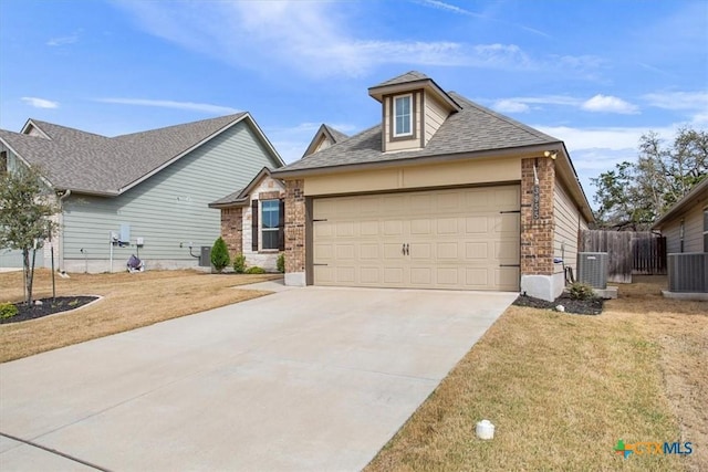 view of front of property with a garage, brick siding, driveway, and central AC