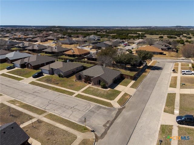 birds eye view of property with a residential view