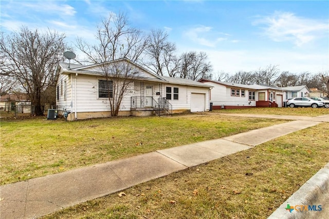 view of front of house featuring a front yard and central air condition unit