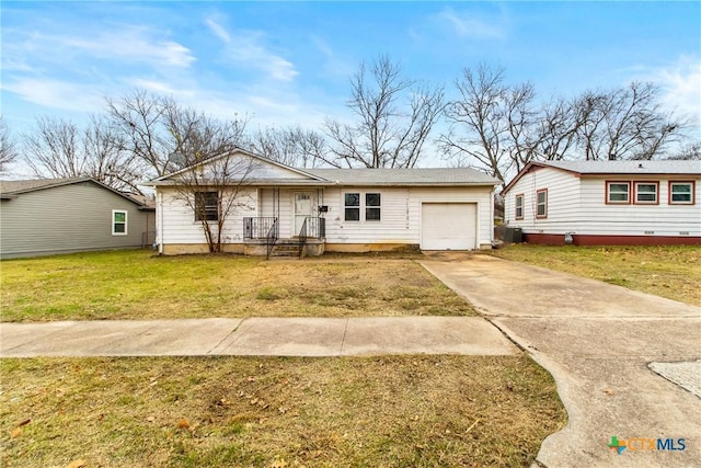 single story home featuring a front yard and a garage