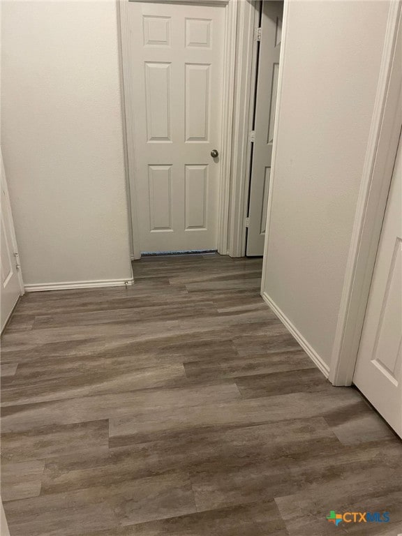2411 Pintail Loop, Copperas Cove, TX 76522 - hall with baseboards and dark wood-style flooring