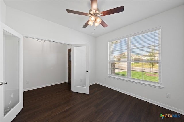 unfurnished bedroom with dark hardwood / wood-style floors and ceiling fan