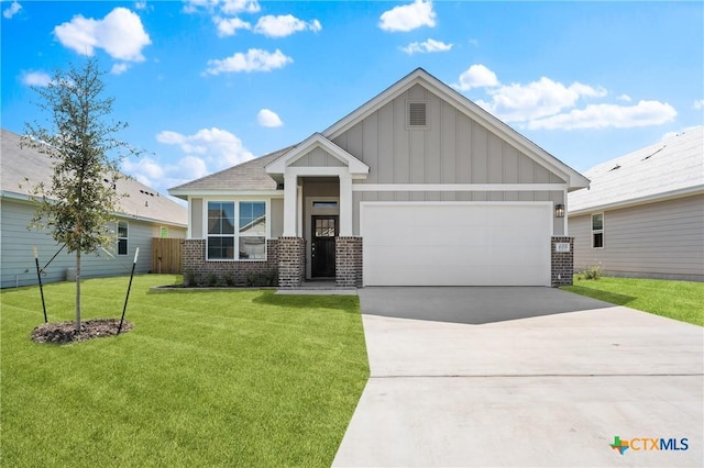 619 Killam Dr, Temple, TX 76502 - craftsman-style house with brick siding, board and batten siding, driveway, and an attached garage