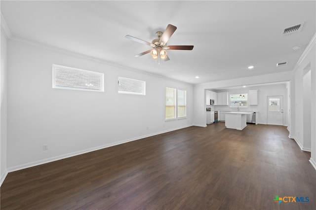 unfurnished living room with sink, ceiling fan, dark hardwood / wood-style flooring, and crown molding