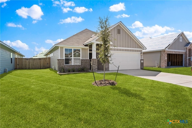 craftsman-style home featuring a garage and a front lawn