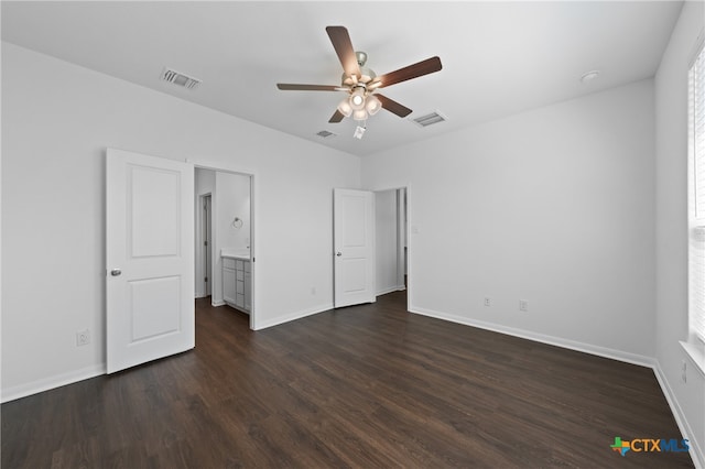 unfurnished bedroom with ceiling fan, dark hardwood / wood-style flooring, and ensuite bath