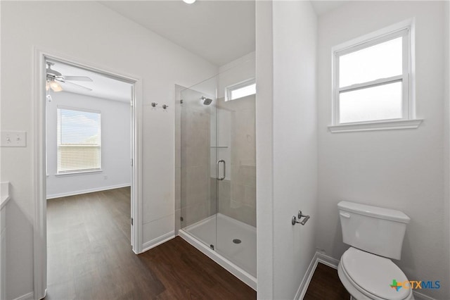 619 Killam Dr, Temple, TX 76502 - full bath featuring wood finished floors, plenty of natural light, a shower stall, and toilet