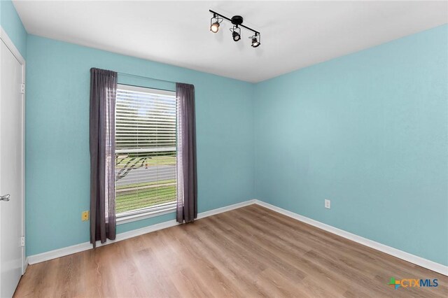 907 Great Oaks Cv, Round Rock, TX 78681 - empty room with wood finished floors and baseboards