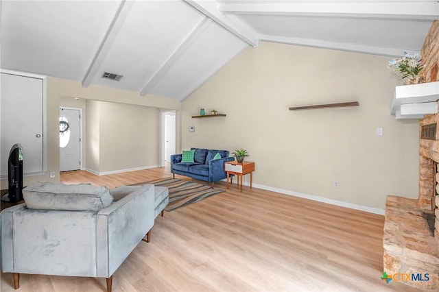 907 Great Oaks Cv, Round Rock, TX 78681 - living room with a stone fireplace and light wood-style flooring